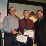 Big Brother Jeff Gage and Little Brother Jax receive their Big and Little of the Year Award from Kristen Kerns, YBBBS Executive Director, and Jonathan Knight, YBBBS board vice-chair from Desert Financial Credit Union. Courtesy/YBBBS.